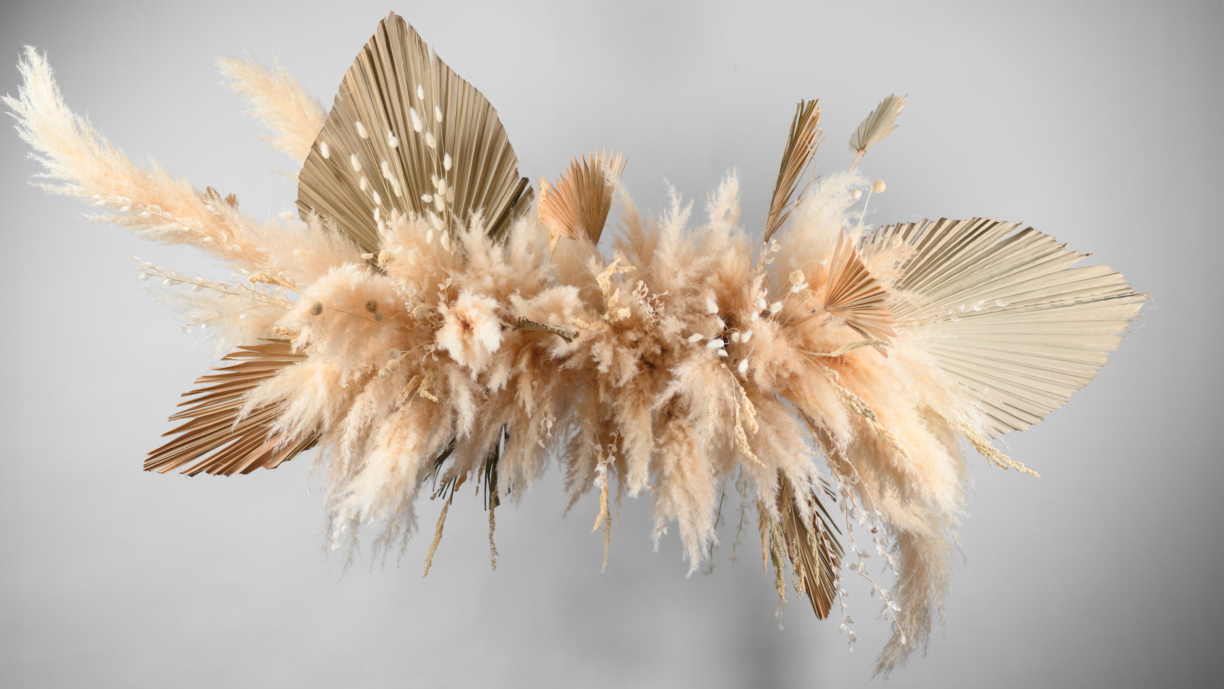 Large hanging dried flower composition for an interior