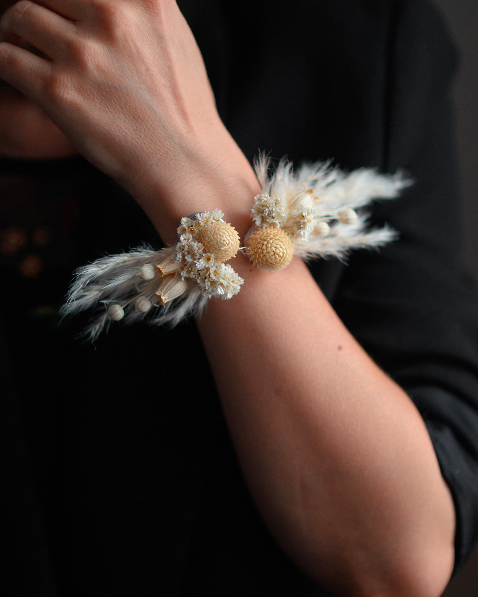 Dried flower bracelet worn on a wrist
